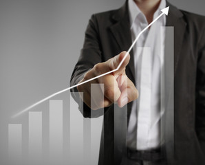 Businessman with financial symbols coming