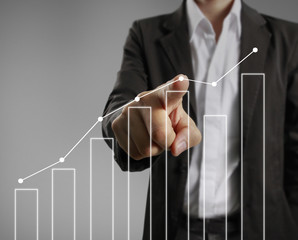 Businessman with financial symbols coming