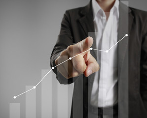 Businessman with financial symbols coming