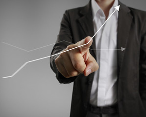 Businessman with financial symbols coming
