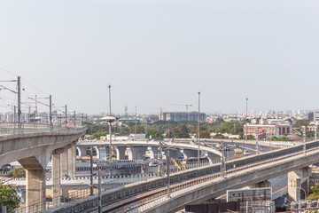 Chennai india may 27 2018 wide view of metro train bridge seen with nearby national highway road...