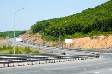 Asphalt road in a bright sunny day with a slight movement