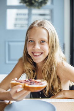 Young girl with toast with jam