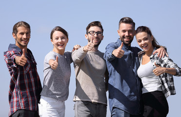 group of young people showing thumb up