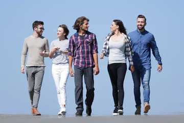 team of young people walking along the road.outdoors