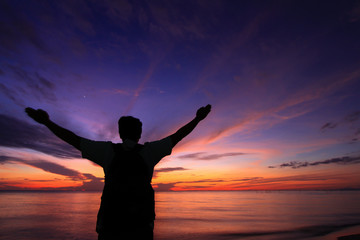 Fototapeta premium Silhouette of a man in the beautiful sunrise.