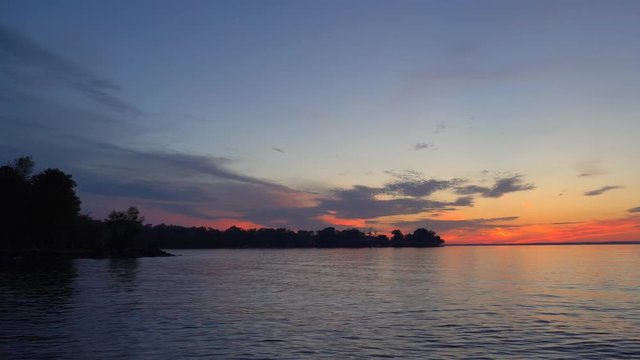 Sunset over water and beach in De La Salle Park, Lake Simcoe, Georgina, York Region, Ontario, Canada