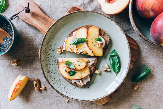 Peach toast with walnuts and basil