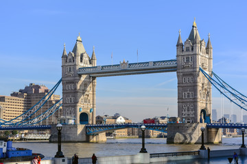 Fototapeta na wymiar Tower Bridge against the winter blue sky. The bascule and suspension bridge crosses the River Thames and has become an iconic symbol of London.