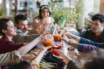 Positive friends with cocktails