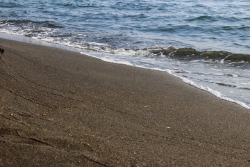 Black magnetic sand beach of Black sea in Ureki, Georgia