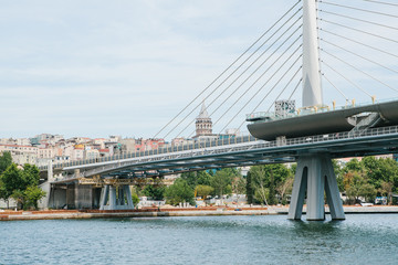 Obraz premium Part of the bridge in Istanbul connecting the Asian part with the European part of the city. The architecture of Istanbul is on the background