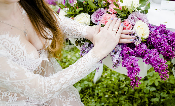 Bride's hands on flowers