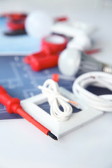 Electrician's supplies on white background, closeup