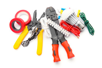 Electrician's supplies on white background