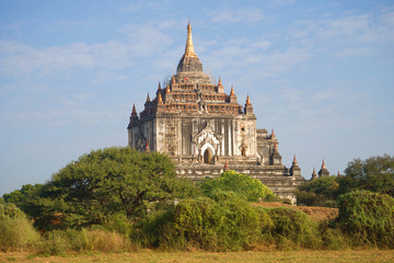 Ancient Buddhist temple of Thatbyinnyu Phaya in the sunny day. Bagan, Myanmar (Burma)