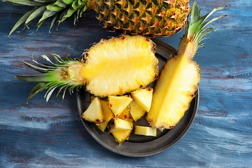 Sliced fresh pineapple on wooden table