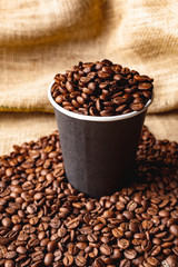 A cup of coffee with you in coffee beans