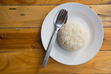 Jasmine Rice cooked rice at Phuket Thailand,Wood background, brown