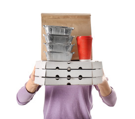Woman with products in paper bag and containers on white background. Food delivery service