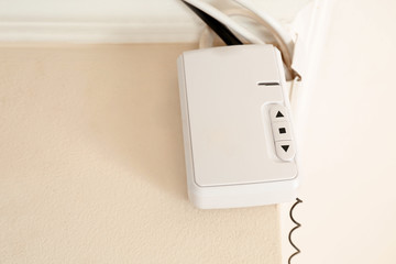 Element of modern alarm system on wall indoors