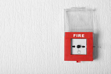 Modern fire call point on wall indoors