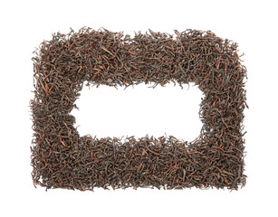 Frame made with dry tea leaves on white background, top view