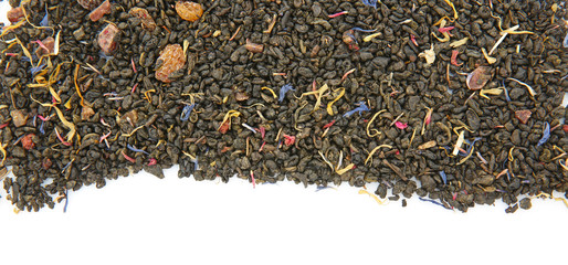 Dry tea leaves on white background, top view