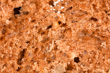 Bread with seeds and raisins as a background
