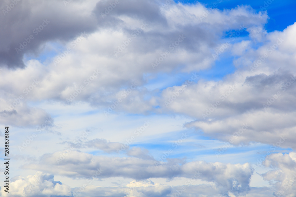 Wall mural clouds on a blue sky as a background