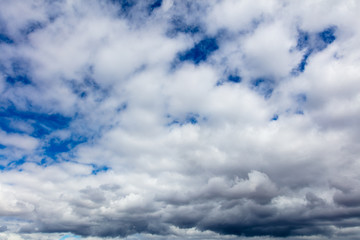 Clouds on a blue sky as a background