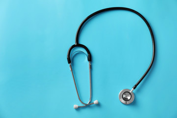 Stethoscope on color background. Health care concept