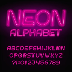 Neon tube alphabet font. Neon color letters and numbers. Retro vector typeface for your design.