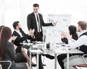  business team gives a presentation of a new financial project for the business partners of the company