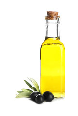 Fresh olive oil in jug and black olives on white background