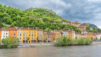 Fototapeta premium Grenoble, panorama of beautiful typical houses on the river Isere, in the center 