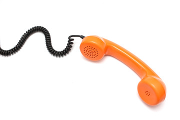 Orange retro telephone tube isolated on white background.