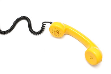 Yellow retro telephone tube isolated on white background.