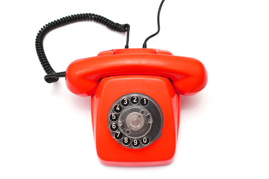 Red retro telephone isolated on white background