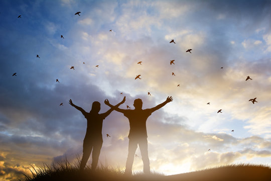 christian people worship God over the cross in cloudy sky - Powered by Adobe