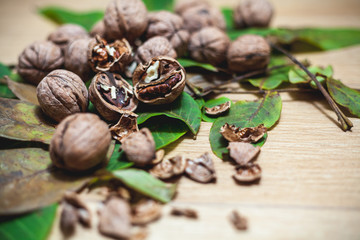 Fototapeta na wymiar Several walnuts lie on brown background