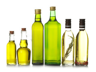 Glassware with olive oil on white background