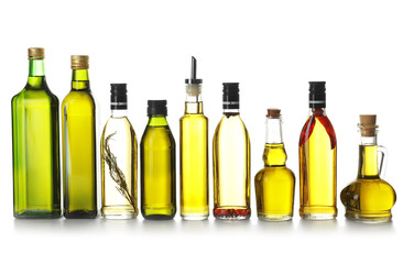 Glassware with olive oil on white background