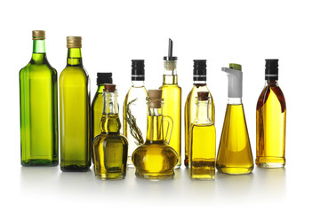 Glassware with olive oil on white background