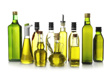 Glassware with olive oil on white background