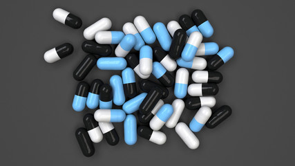 Pile of black, white and blue medicine capsules