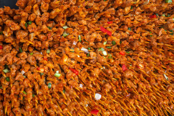 Summer meat skewers pile up on the grill