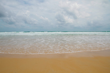 Fototapeta na wymiar Beach wave sea summer day with sand in beach summer travel holiday
