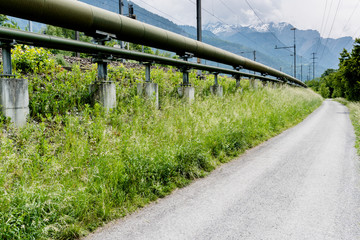 gas pipeline on the side of a country road in the Swiss Alps