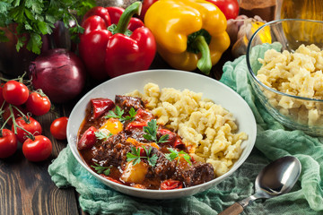 Hungarian beef goulash serwed with galuska noodles